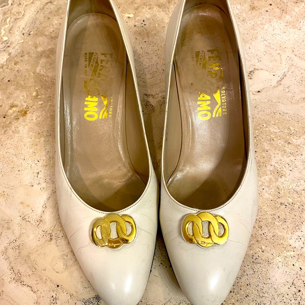 Ferragamo white pumps with gold buckle